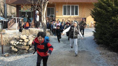 The students walk (race) to the local elementary school in the morning. 