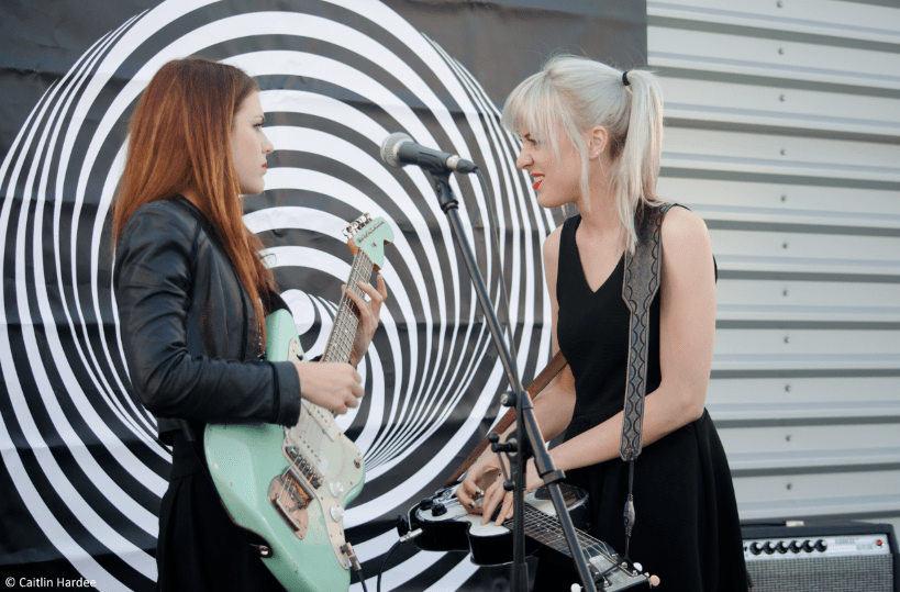 Larkin Poe rock out atop the Universal Germany building. Copyright: Caitlin Hardee